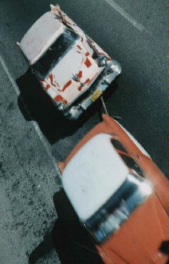 Cubans should be admired for their creativity. Coping is a skill they seem to learn early and sharpen on a daily basis. Here one fifties relic towing another as the towee waves for the camera.