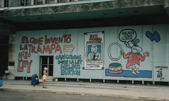 These giant cartoons decrying the inequity of the Helms-Burton Act grace the side of a building directly accross from Havana's premier tourist hotel: 