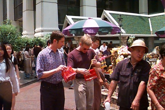 Making an offering for good luck on the road Andrew enters his sixth seven-year cycle with blessings from nine monks.