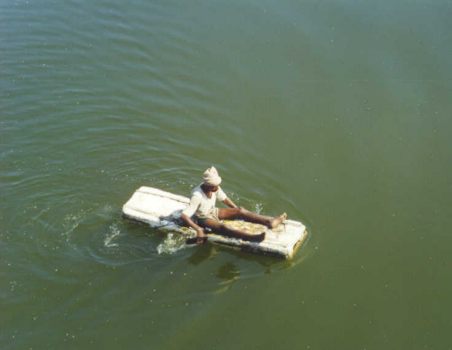 Crossing the mighty Godavari river the hard way, on a piece of styrofoam with only hands for paddles